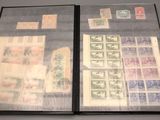 a lot of stamps on a book on a table