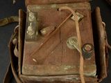 an old suitcase that has some tools in it