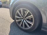 a close up of a car ' s tire on the road