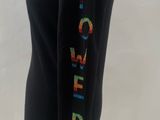 the back of a black sweater with the word power written on it