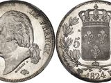 a silver coin with a crown on top of it