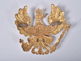 a gold bird with a crown on it ' s head