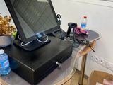 a laptop computer sitting on top of a wooden table