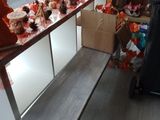 a table with a bench in front of a window