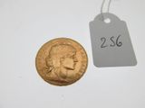 an image of a gold coin with a price tag attached to it