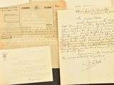 several old letters and envelopes are on a table