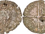 a close up of two old silver coins on a white background