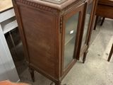 a marble top cabinet in the middle of a room