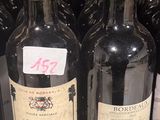 many bottles of wine that are on display in a store