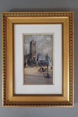 tableau encadré représentant une rue de la ville avec une tour horloge en arrière-plan