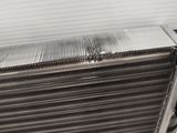 a close up of an aluminum radiator on a white background