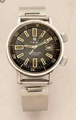 a silver watch with a black face on a white surface
