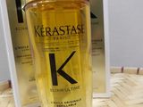 the bottle of kerastasel is next to a box of kerastasel
