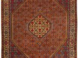 un tapis rouge et bleu à motifs de médaillons