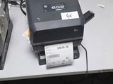 a printer sitting on top of a table next to a laptop