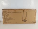 cardboard box with a picture of a swing on it on a table