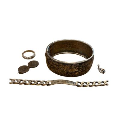 an image of a bracelet, ring, and other jewelry on a white background