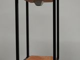 an image of a black and wood table with a shelf