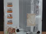 packaging of a white electric heater sitting on top of a wooden table