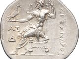 a close up of a silver coin with an image of a woman on it