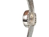 a close up of a watch on a white background