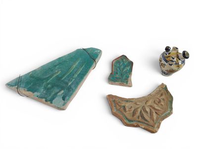 several pieces of pottery sitting on top of a white surface