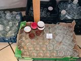 many empty plastic cups sitting on the floor next to a box of empty plastic cups