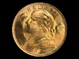 gros plan d'une pièce d'or portant un visage de femme