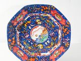 a blue plate with a picture of a horse on it