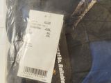 a bag of luggage sitting on the floor with a price tag on it
