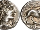 a silver coin with an image of a horse on it