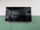 a flat screen tv hanging on the wall in a room
