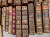 many old books that are stacked on top of each other