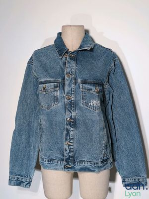 denim jacket on a mannequin dummy with a white background