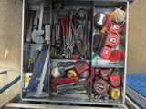a metal box with many tools in it