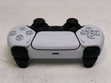 a close up of a video game controller on a table
