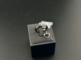 a black box with a silver ring inside of it