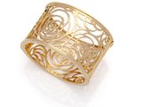 a close up of a gold ring on a white background
