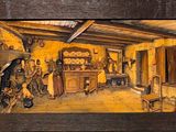 une photo d'un tableau représentant une cuisine, dans un cadre en bois