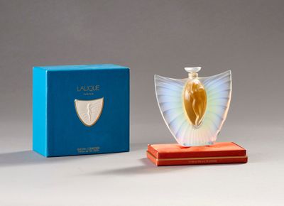 an image of a glass angel figurine next to a blue box