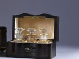 a small black box with a set of glassware in it