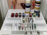 a display of bracelets and other jewelry on a table
