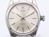 a silver watch with a silver face on a white background