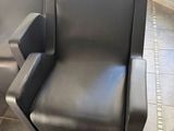 a chair that is sitting in the corner of a room