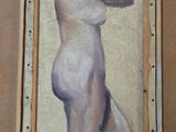 a picture of a painting of a nude woman hanging on a wall