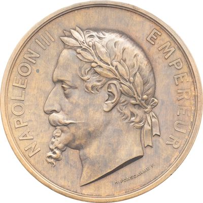 Gros plan sur une pièce de monnaie portant le visage d'un homme