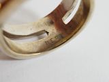 a close up of a ring on a white surface