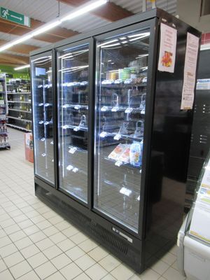 an image of a grocery store with refrigerators in it