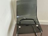 a chair that is sitting in the corner of a room