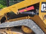 a picture of a cat ski - door parked in a lot
